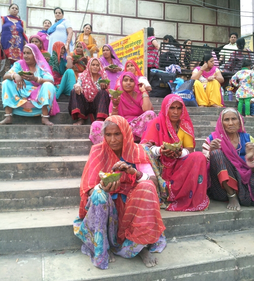 women with woven baskets waiting for the ceremony to begin 